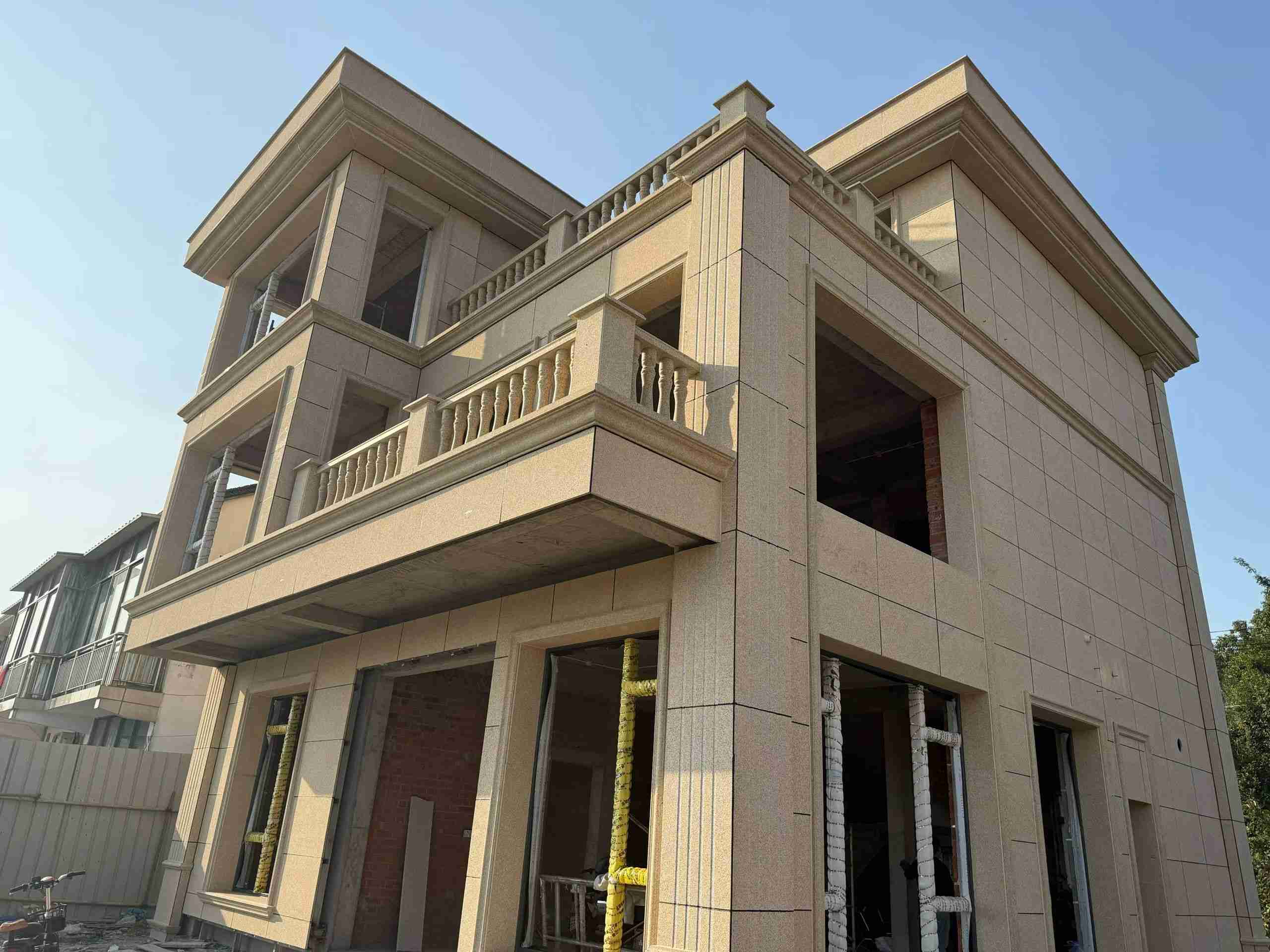 河南 黄金麻花岗岩石材荔枝面外墙干挂效果展示